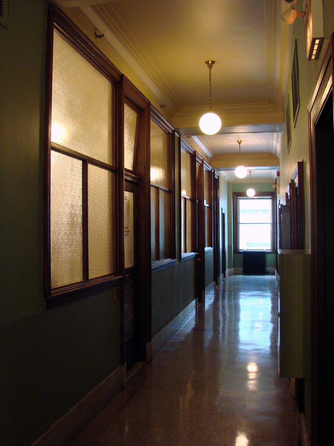 Interior corridor with frosted glass partitions